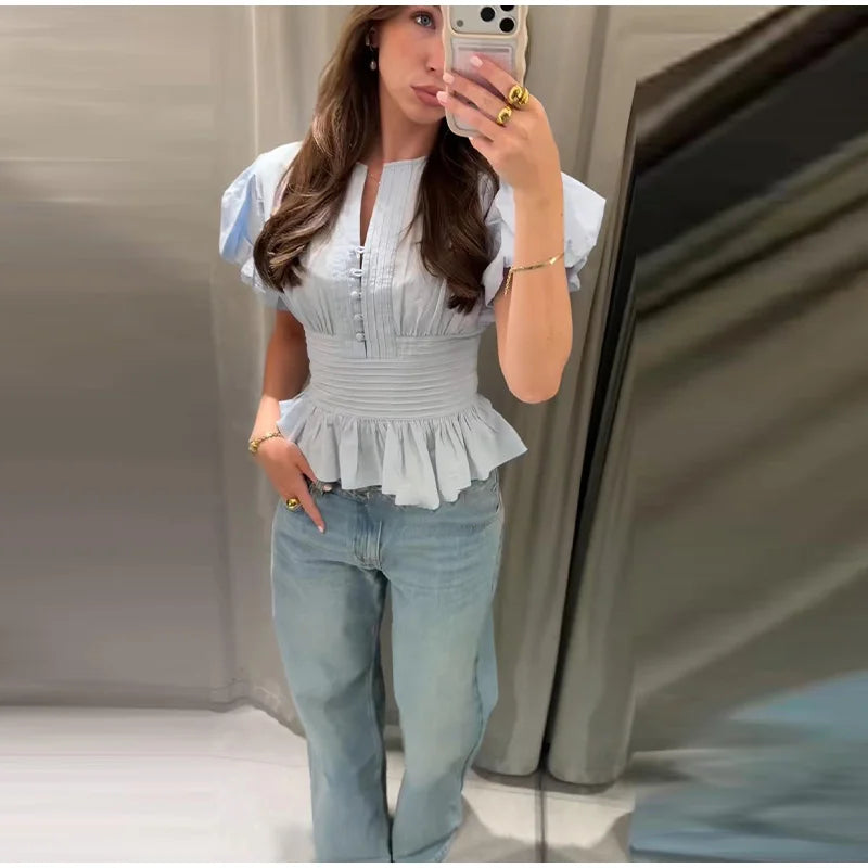 Cute Sky blue ruffled blouse.