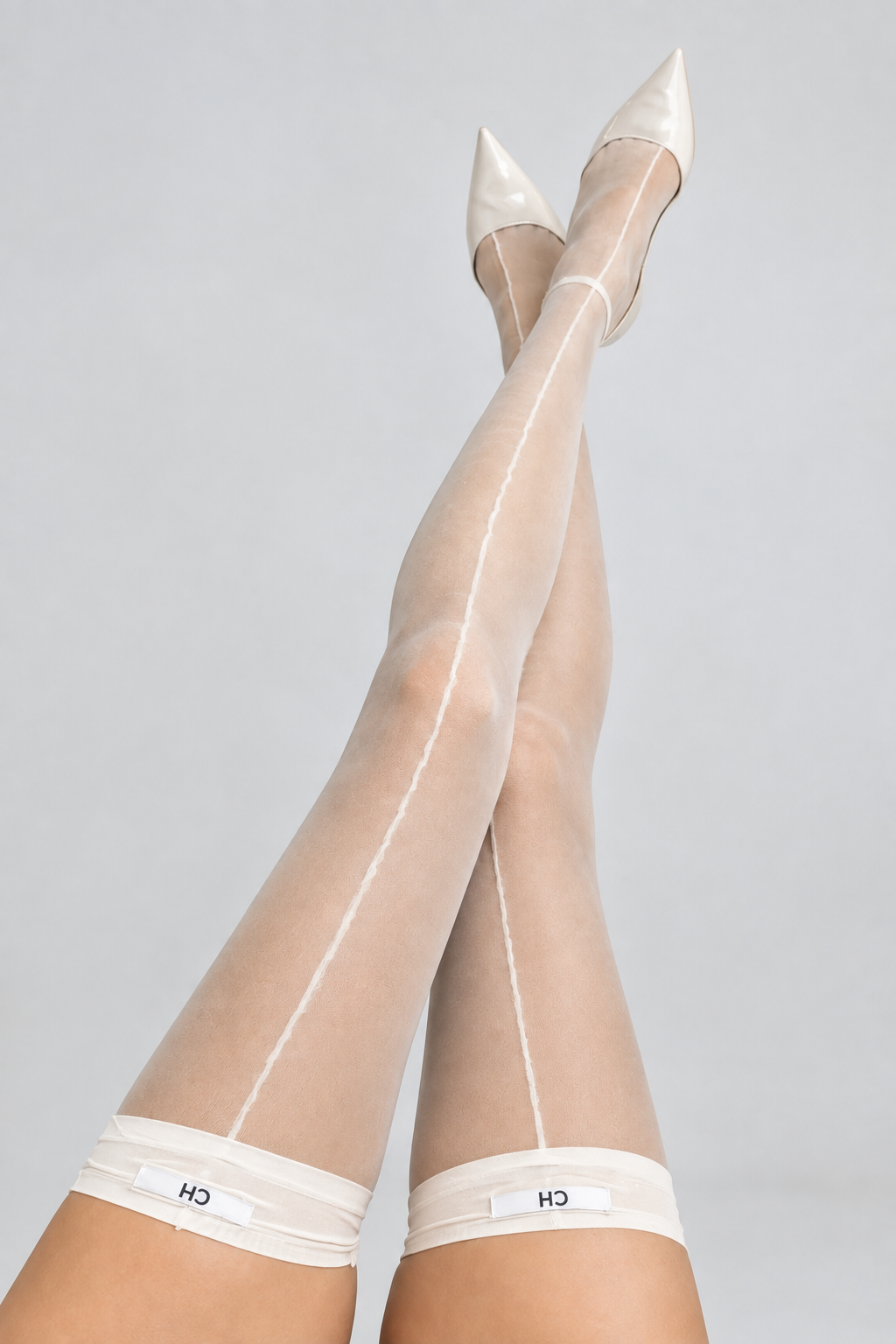 Product photo of Elara Sheer Back-Seam Thigh-High Stockings.