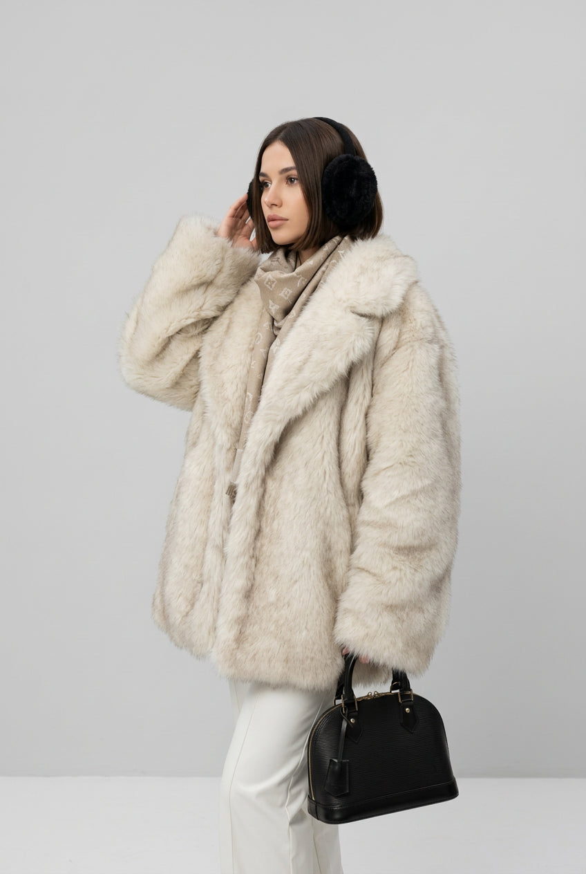 Creamy-white faux fur coat styled to show the turn-down collar