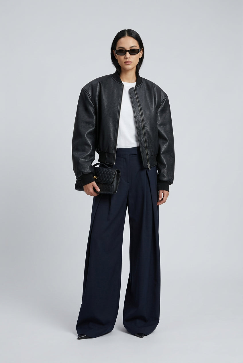 Green double-zip jacket styled as a subtle statement layer