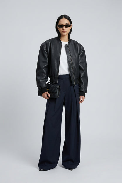 Green double-zip jacket styled as a subtle statement layer