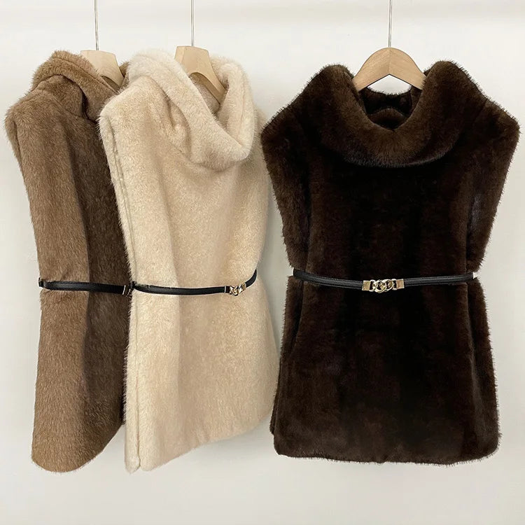 Women's faux fur vest in beige, front view

Women's plush faux fur vest with matching belt

Women's brown faux fur vest, sleeveless design

Women's faux fur vest with long front and short back

Close-up of plush faux fur vest texture

Women's faux fur vest styled with a long-sleeve top