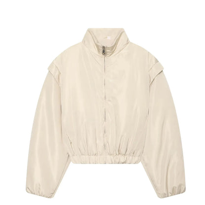 Cropped satin bomber jacket styled as women's casual outerwear