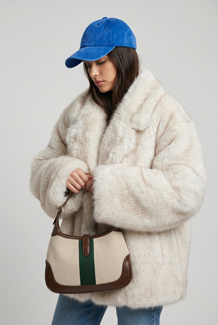 Creamy-white gradient faux fur coat with a classic turn-down collar, front view