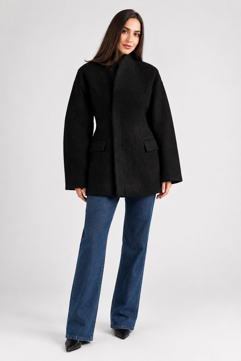 Women's black V-neck coat
Women's white V-neck coat
Women's coat with covered-button closure
Close-up of women's V-neck coat
Women's black coat front view
Women's white coat front view
Women's coat styled with trousers
Women's coat styled with jeans
Women's coat with full-length sleeves
