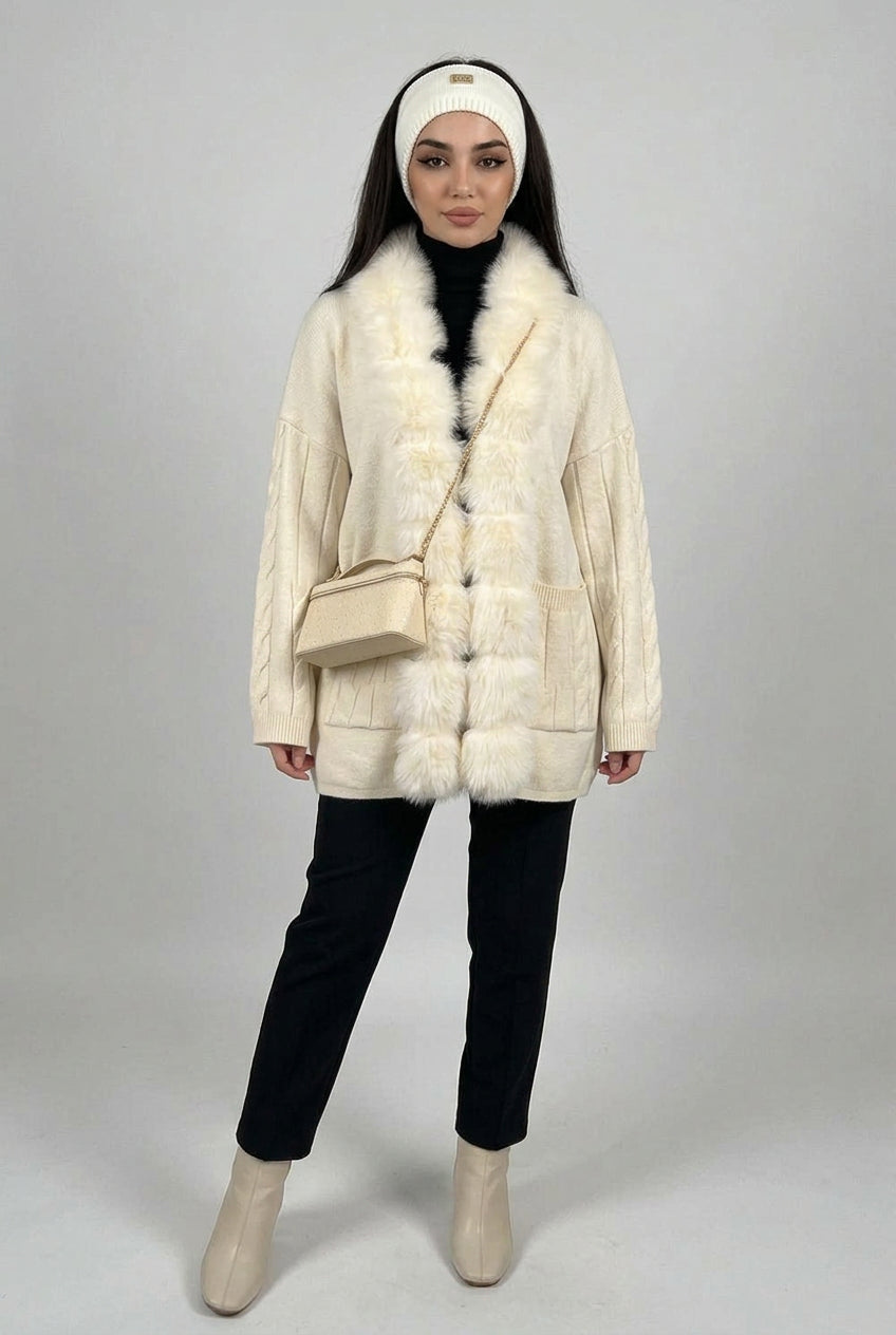 Cable-knit cardigan styled as a cozy cold-weather layering piece