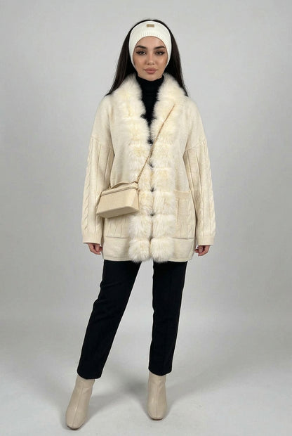 Cable-knit cardigan styled as a cozy cold-weather layering piece