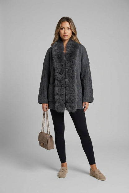 Long-sleeve cable-knit cardigan showing the collar and front opening