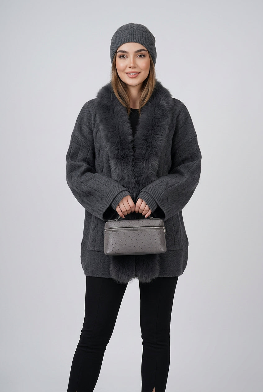 Brown cable-knit cardigan showing the faux-fur trim and button front