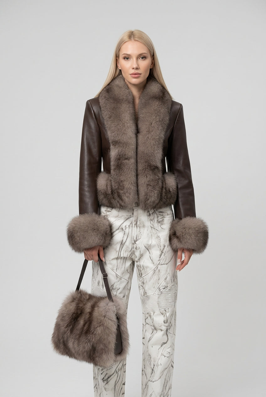 Detail of the collar and front closure on the faux fur jacket