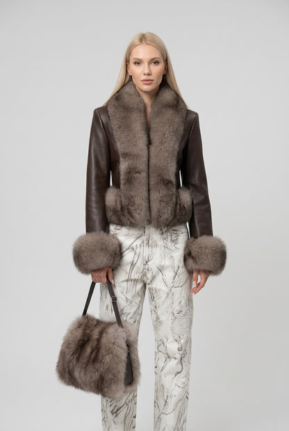 Detail of the collar and front closure on the faux fur jacket