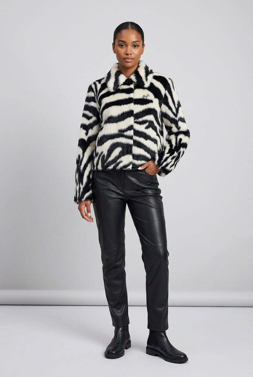 Close view of the black-and-white zebra pattern on the faux fur jacket
