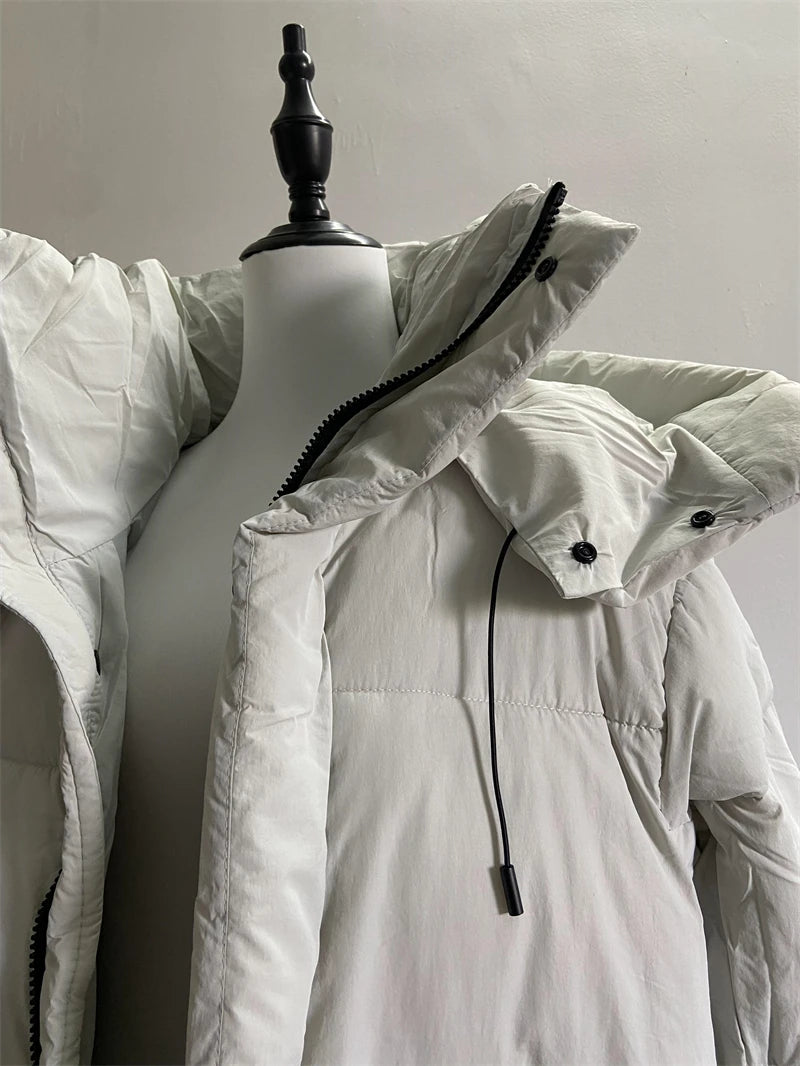 Long women's puffer coat designed for cold-weather outfits