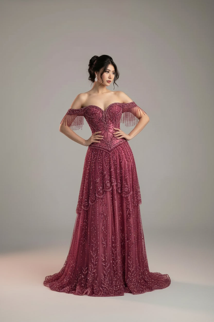 Luxury beaded evening gown, off-the-shoulder formal dress, elegant gala dress for women, designer-inspired evening wear, wedding guest evening dress, black tie event gown, luxury occasion dress, embellished formal gown, beaded tassel dress, red carpet evening gown, sophisticated women's formal wear, evening gown for special occasions, luxury wedding guest dress, fitted evening dress, glamorous formal dress for women.