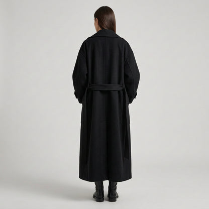 Double-breasted coat showing its tailored silhouette and pockets