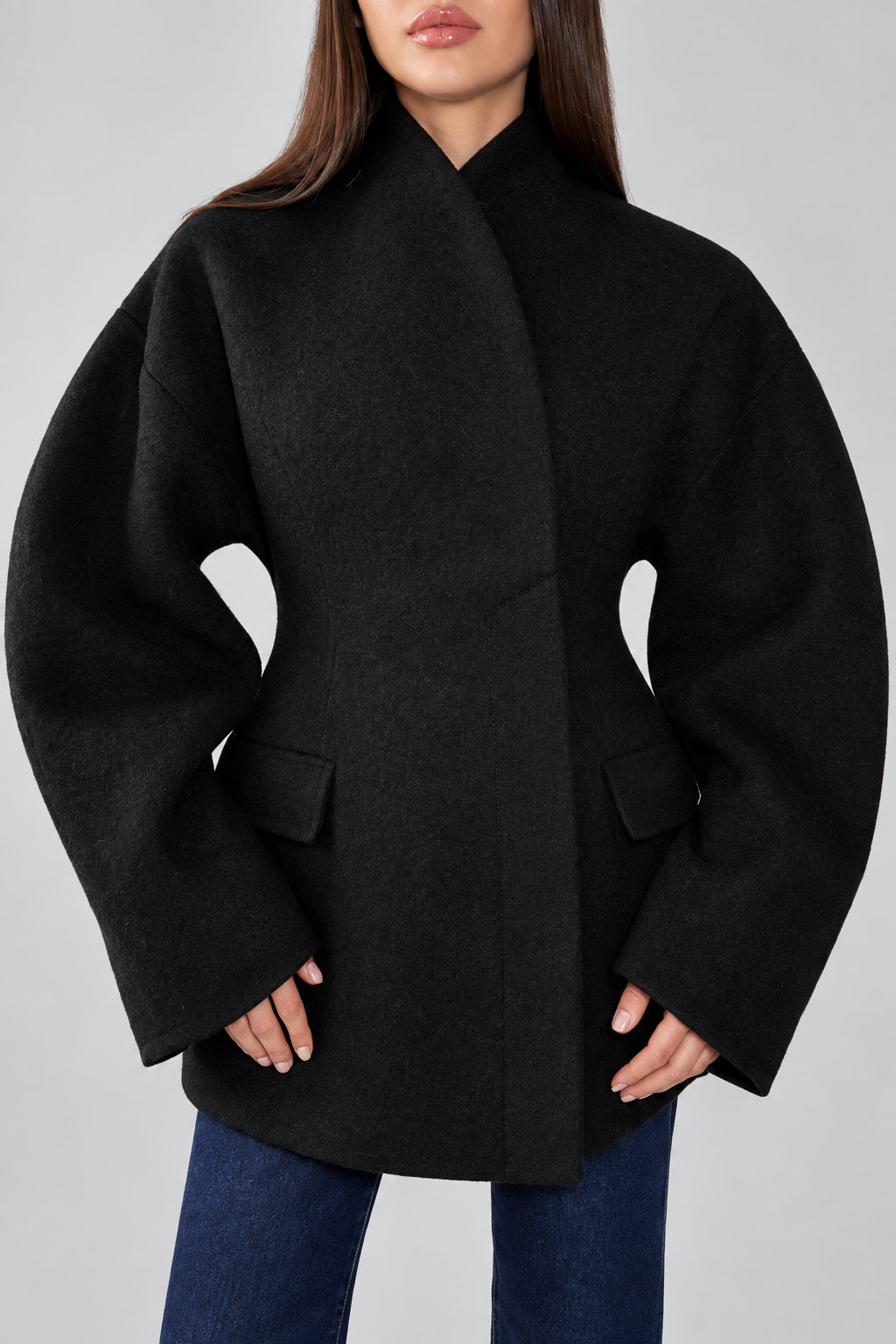 Women's black V-neck coat
Women's white V-neck coat
Women's coat with covered-button closure
Close-up of women's V-neck coat
Women's black coat front view
Women's white coat front view
Women's coat styled with trousers
Women's coat styled with jeans
Women's coat with full-length sleeves