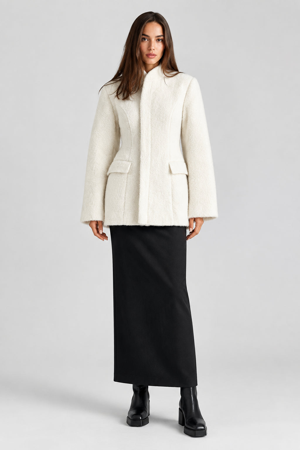 Women's black V-neck coat
Women's white V-neck coat
Women's coat with covered-button closure
Close-up of women's V-neck coat
Women's black coat front view
Women's white coat front view
Women's coat styled with trousers
Women's coat styled with jeans
Women's coat with full-length sleeves