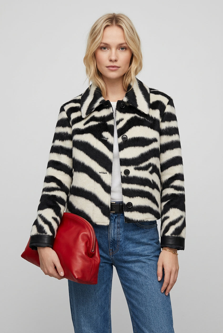 Cropped faux fur jacket with bold zebra stripes for autumn and winter outfits
