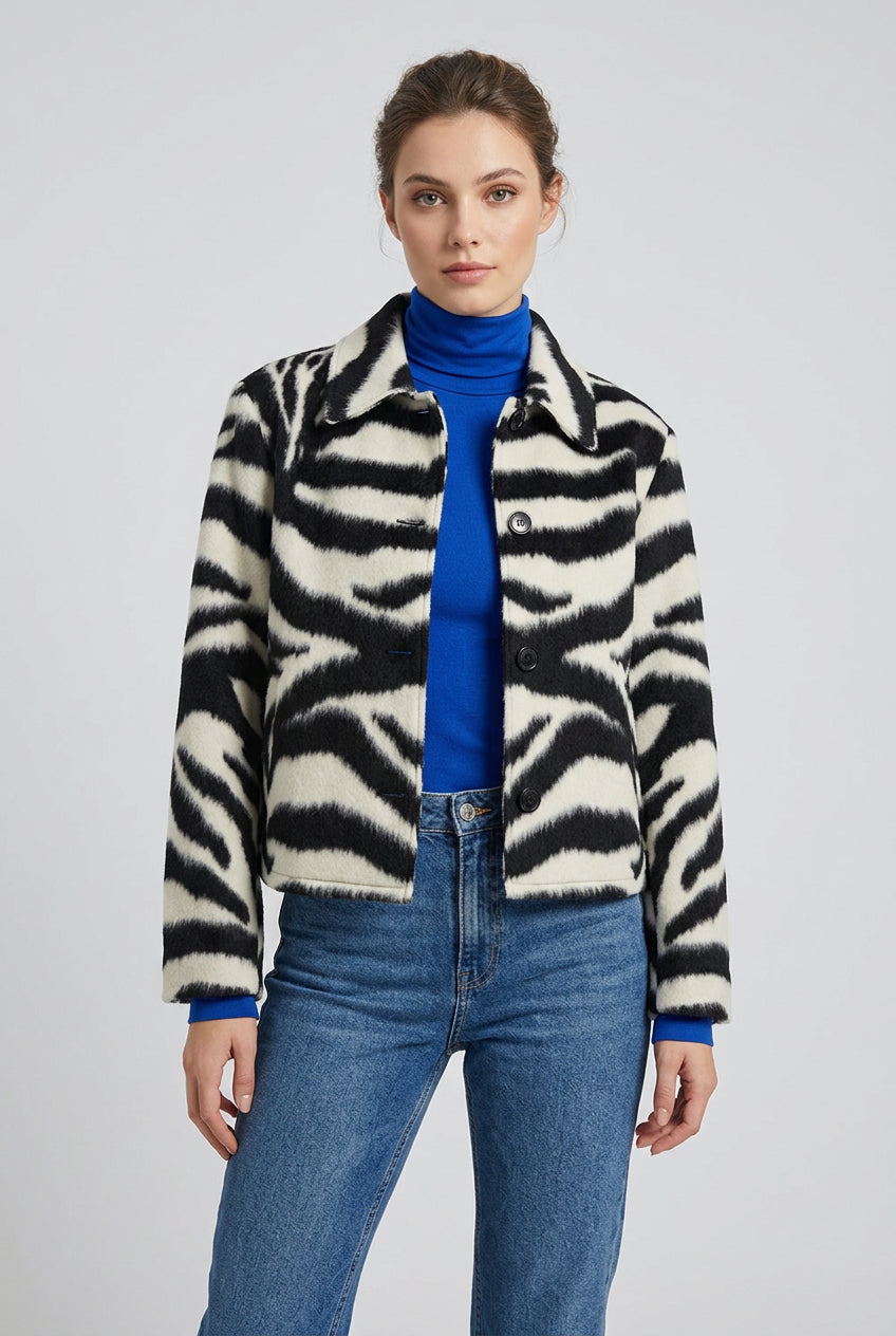 Zebra-print faux fur jacket styled as a statement outerwear piece
