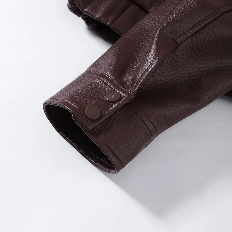 Side view showing the cropped jacket's shape and sleeve