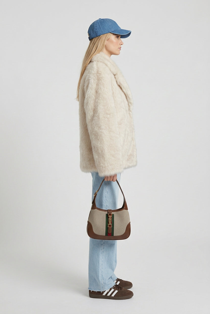Creamy-white ombre faux fur coat showing its full silhouette