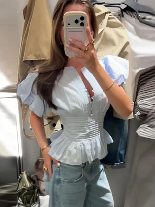 Cute Sky blue ruffled blouse.