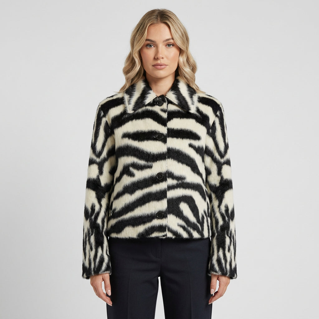 Detail view of the plush texture and zebra print on the Sable jacket