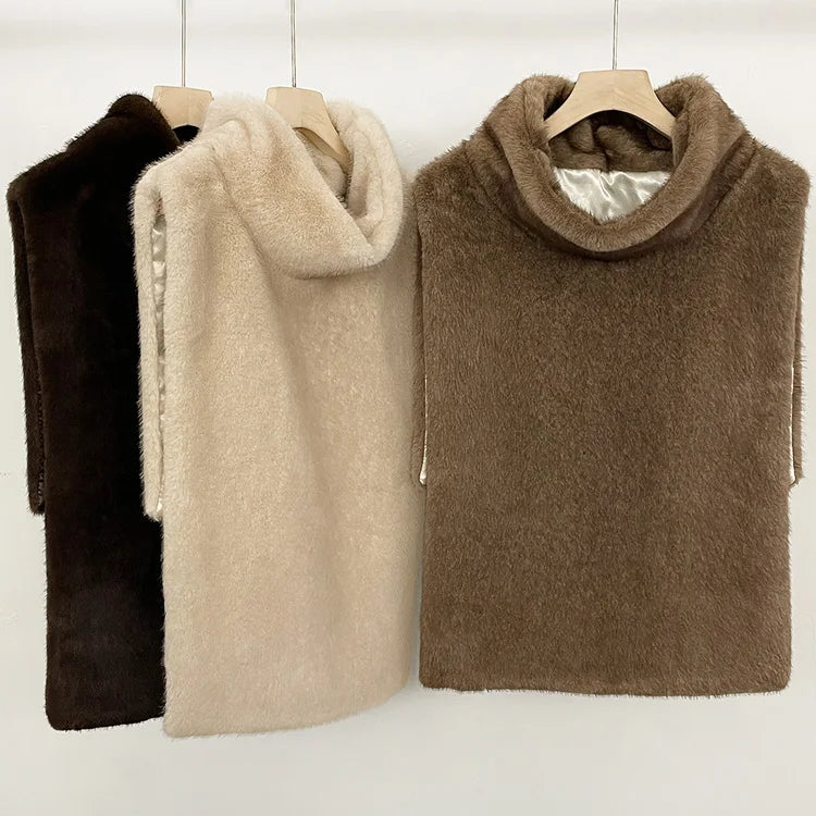 Women's faux fur vest in beige, front view

Women's plush faux fur vest with matching belt

Women's brown faux fur vest, sleeveless design

Women's faux fur vest with long front and short back

Close-up of plush faux fur vest texture

Women's faux fur vest styled with a long-sleeve top