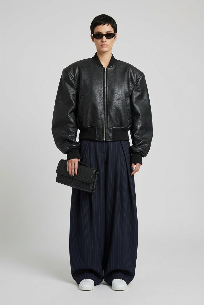 Brown double-zip jacket styled with neutral wardrobe pieces