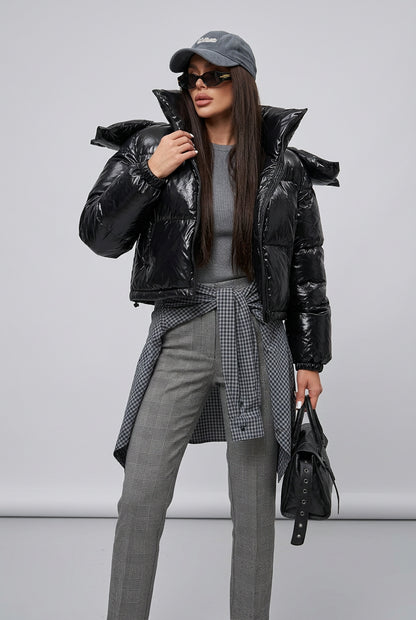 The Nova Puffer showing its hood and front zip closure