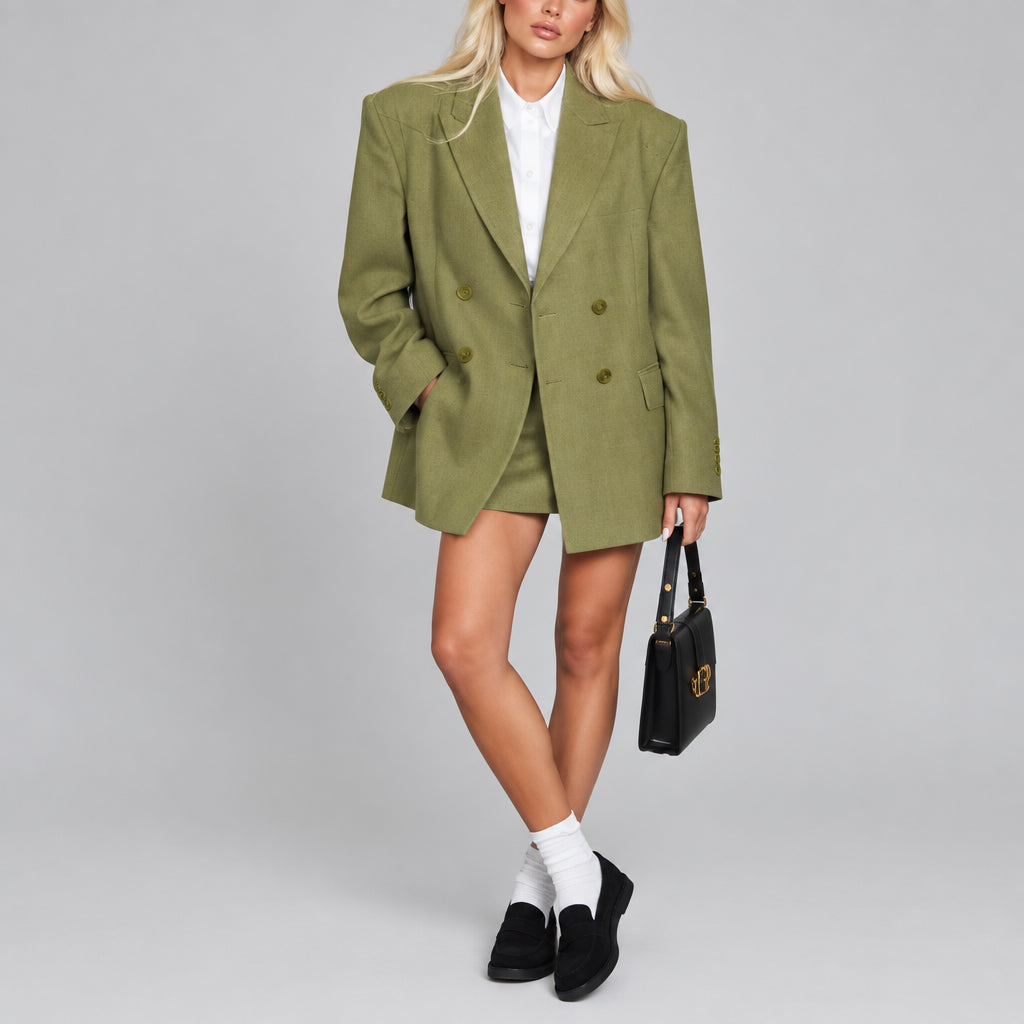 The Verona Blazer in green
The Verona Blazer in black
Women's oversized double-breasted blazer
The Verona Blazer with notched lapel
Green oversized women's blazer
Black oversized women's blazer
Women's blazer with drop shoulders and patch pockets
The Verona Blazer styled with denim
The Verona Blazer styled with trousers
Women's double-breasted blazer streetwear outfit