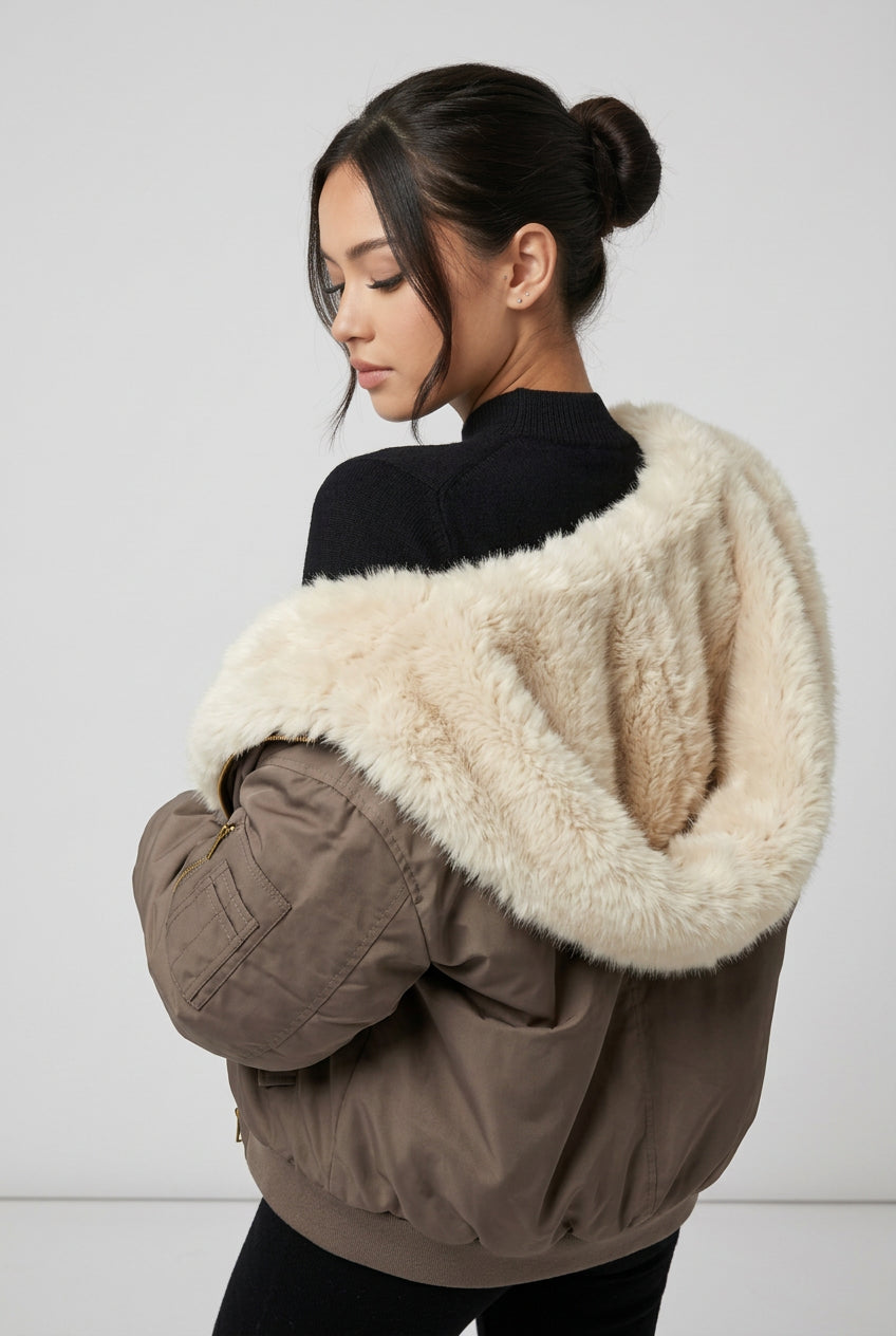 Beige reversible hooded jacket showing its relaxed silhouette