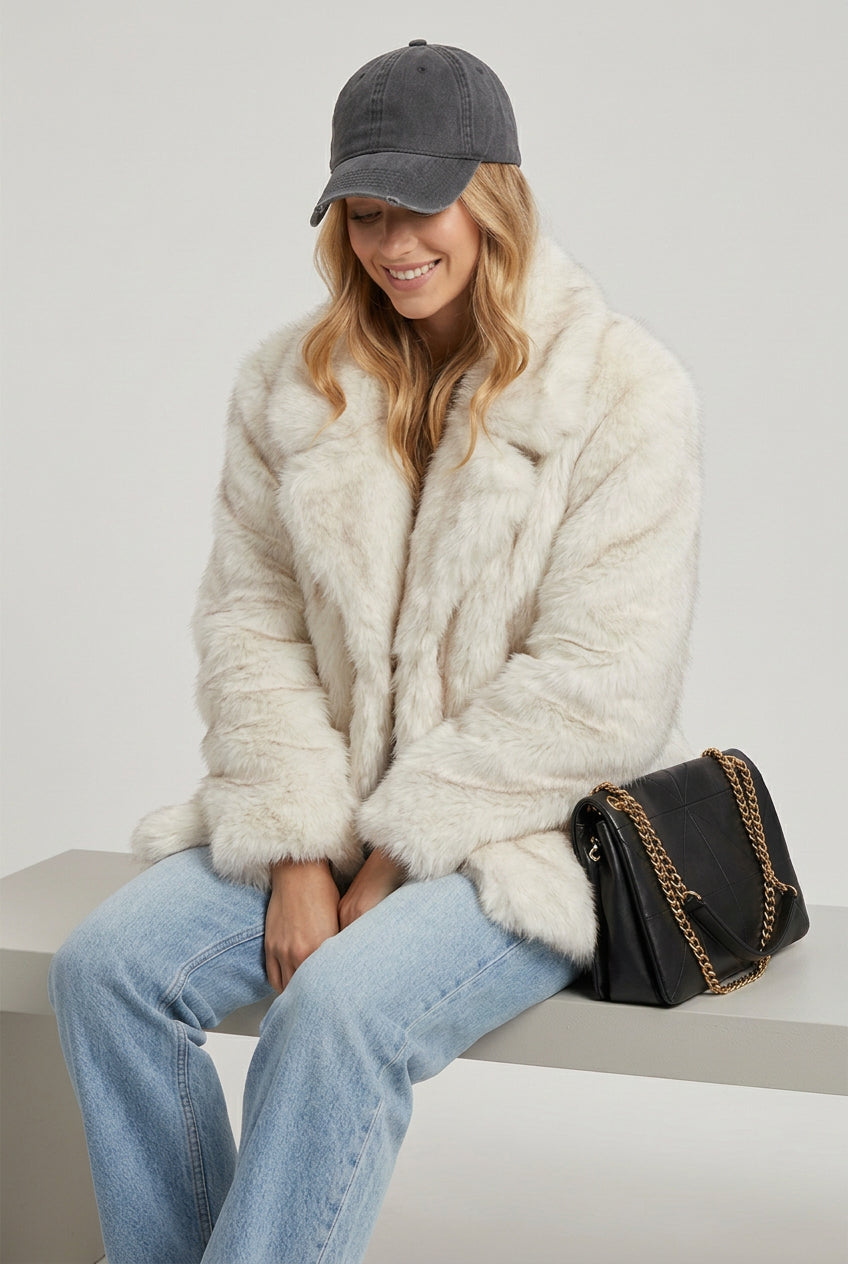 Creamy-white ombre faux fur outerwear shown from another angle
