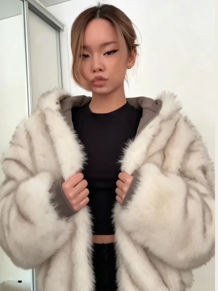 Beige faux-fur hooded jacket with oversized-inspired sleeves