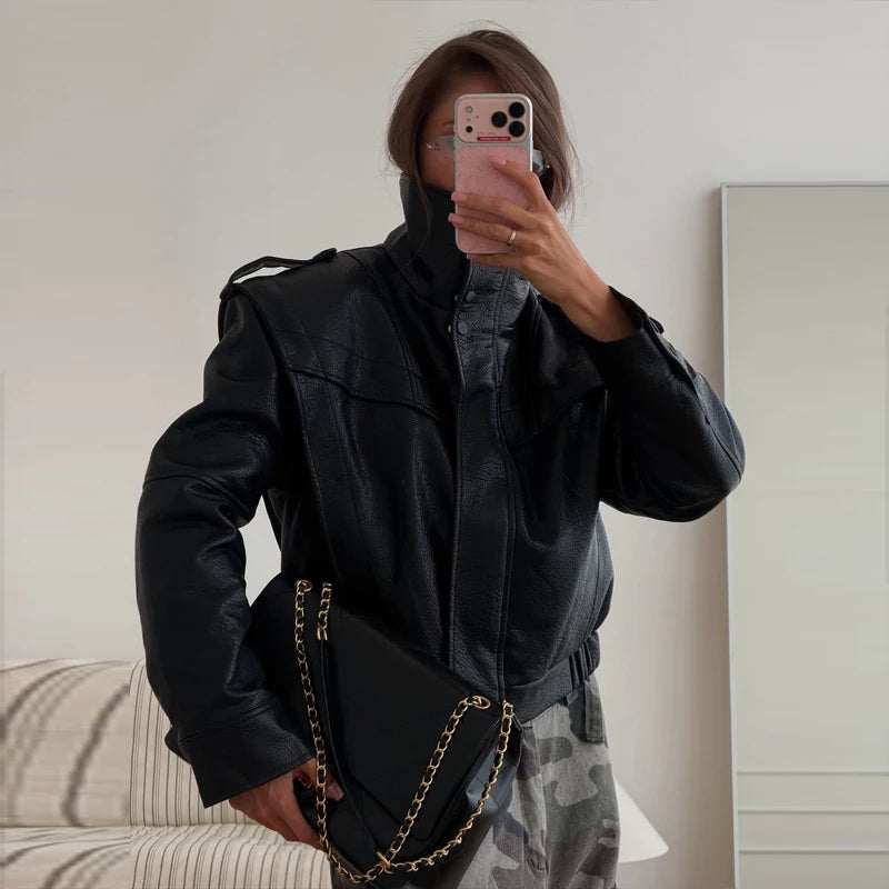 Black cropped jacket showing the front and shoulder detail