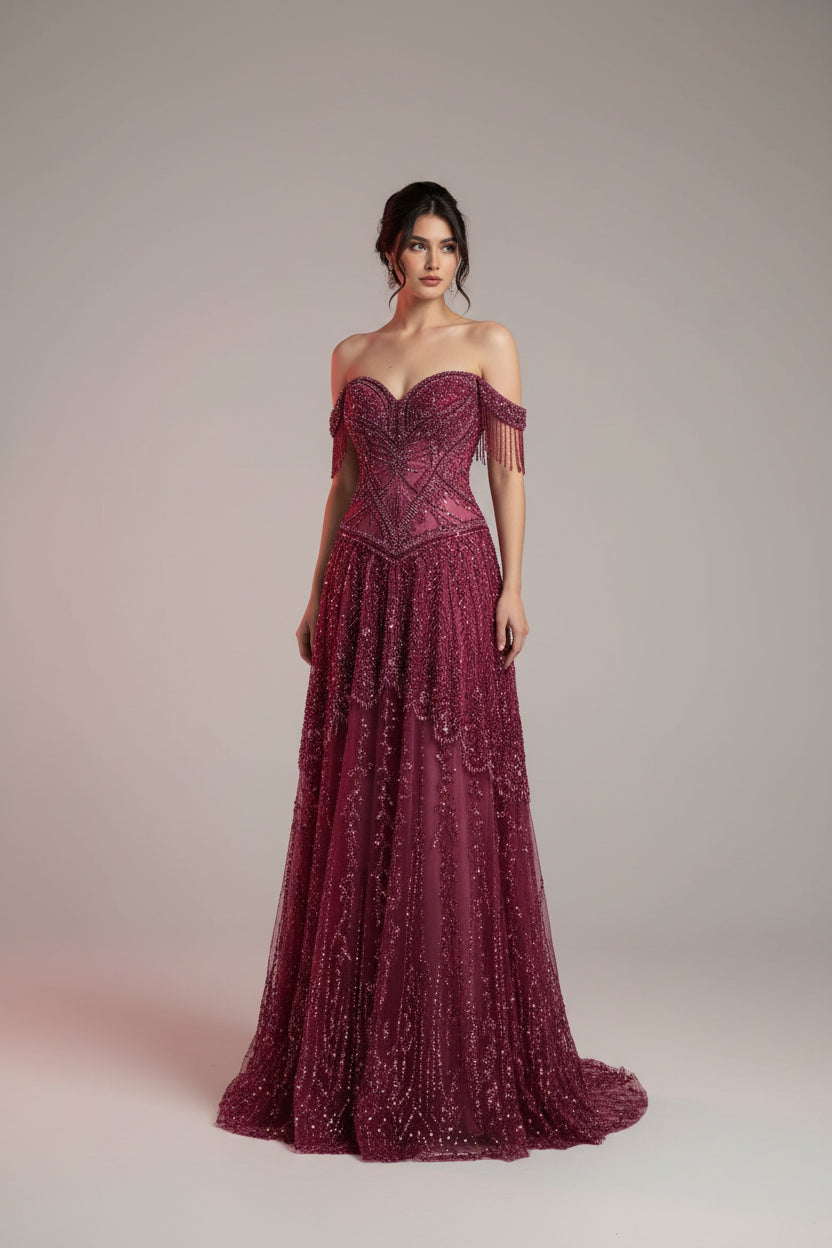 Luxury beaded evening gown, off-the-shoulder formal dress, elegant gala dress for women, designer-inspired evening wear, wedding guest evening dress, black tie event gown, luxury occasion dress, embellished formal gown, beaded tassel dress, red carpet evening gown, sophisticated women's formal wear, evening gown for special occasions, luxury wedding guest dress, fitted evening dress, glamorous formal dress for women.