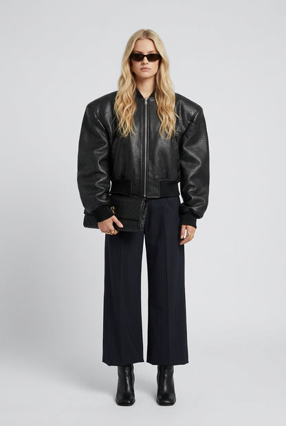 Black double-zip jacket styled for a sleek everyday outfit