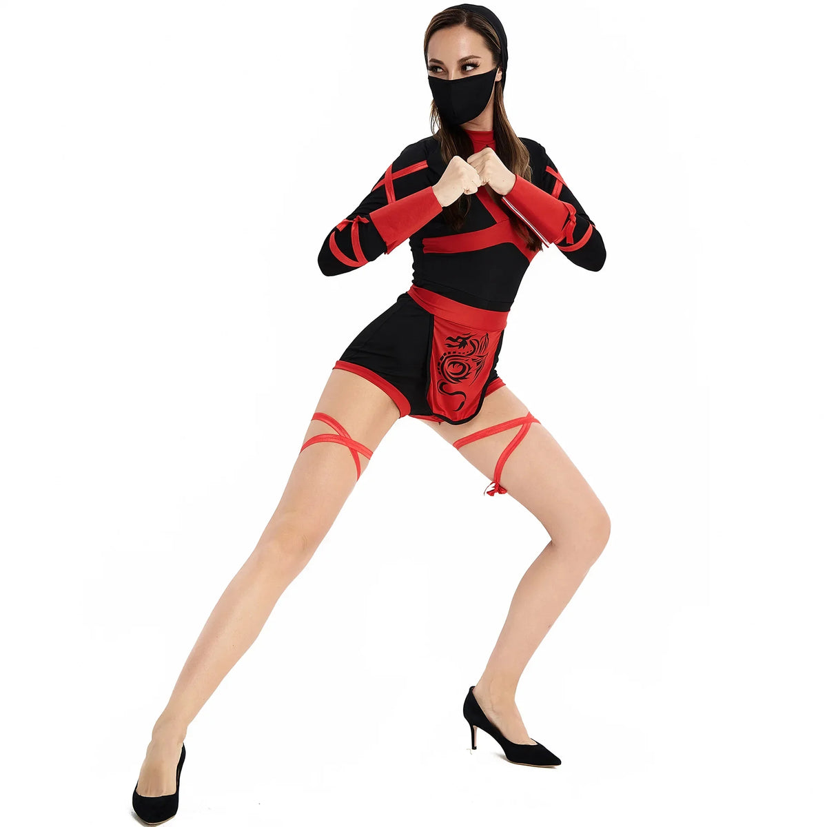 Woman wearing a black and red costume with high heels on a white background
